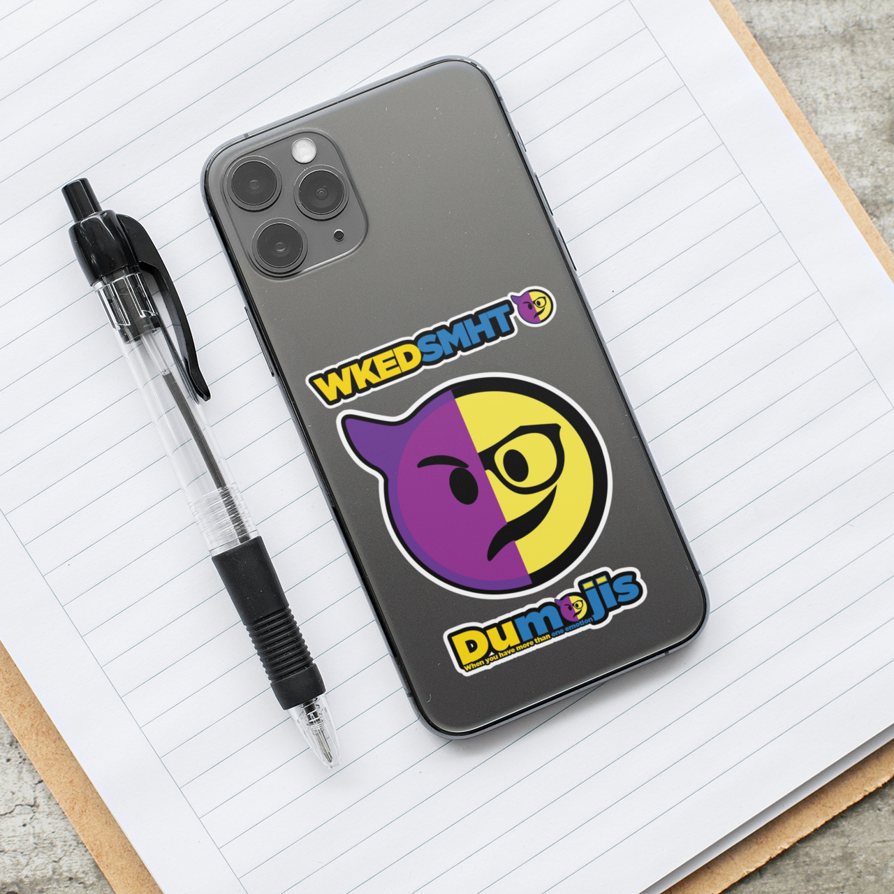Picture of WkedSmht Dumojis vinyl sticker on the back of an cellphone